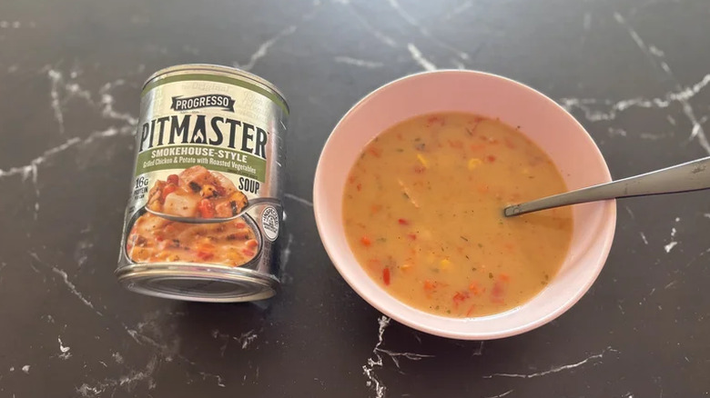 A bowl of Progresso Pitmaster soup next to its can.