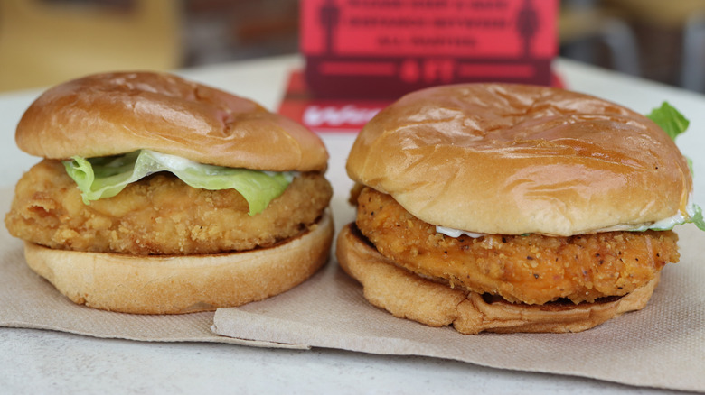 two Wendy's chicken sandwiches on napkins