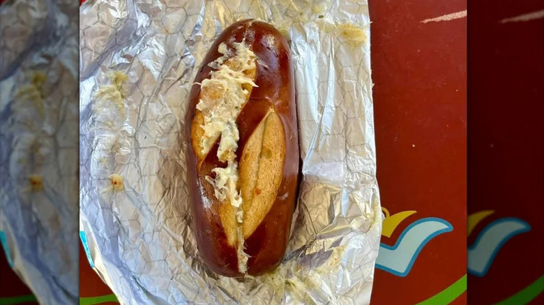 Top view of cheesy garlic pretzel bread on its wrapper