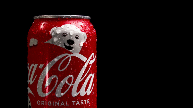 Can of Coca-Cola with polar bear on black background