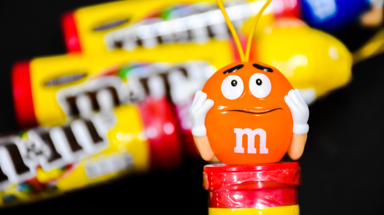 Orange M&M character on candy packaging