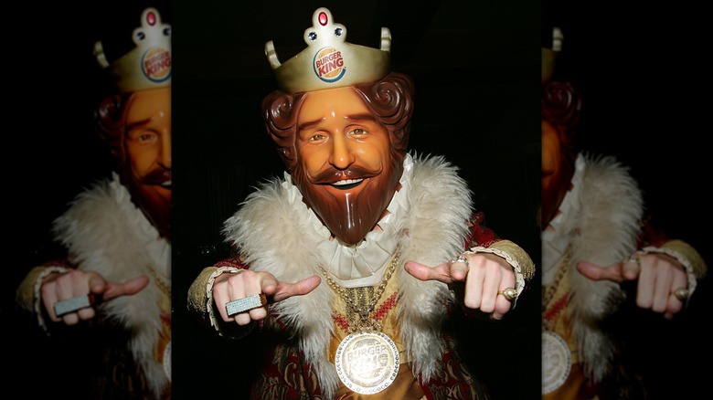 Burger King's King mascot pointing at the camera
