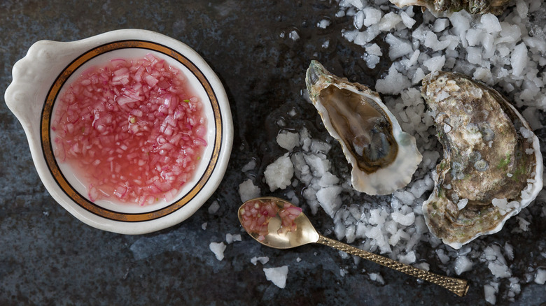 Shucked oysters served with mignonette sauce