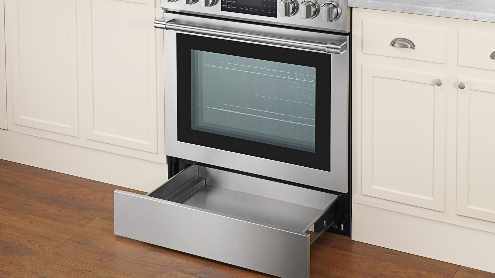 There's An Easy Way To Tell If Your Oven's Bottom Drawer Is For Storage Or Heating Food - Tasting Table