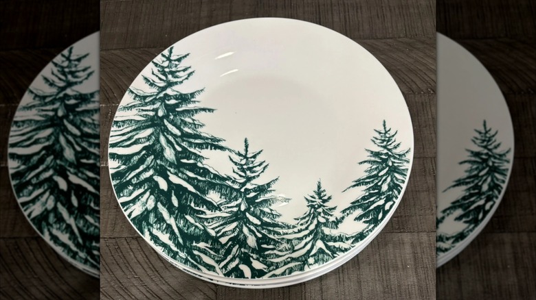 Royal Norfolk Winter dinner plate on a dark wooden background