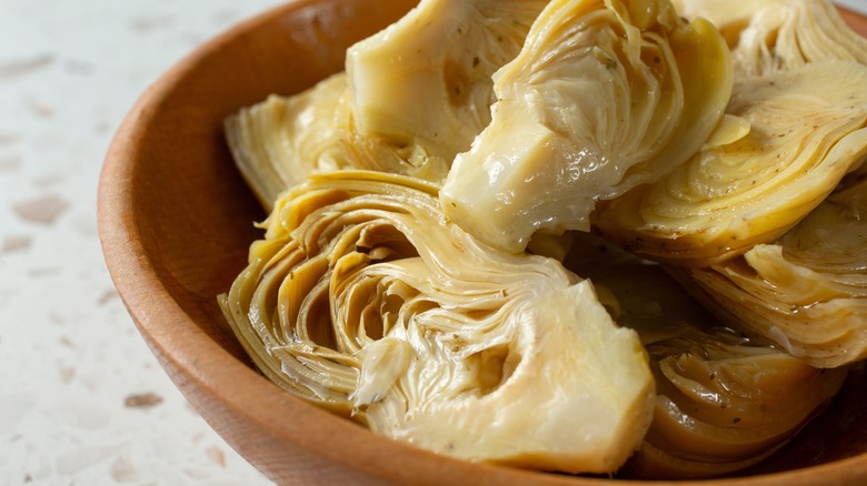 Bowl of canned artichoke hearts
