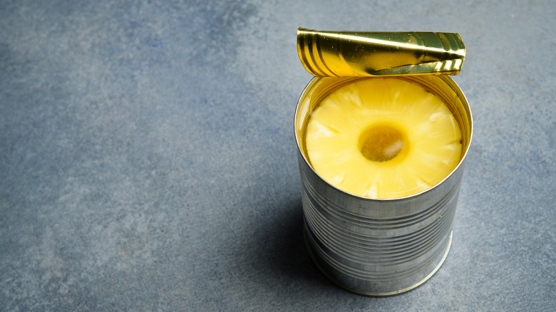 Tin of canned pineapple rings