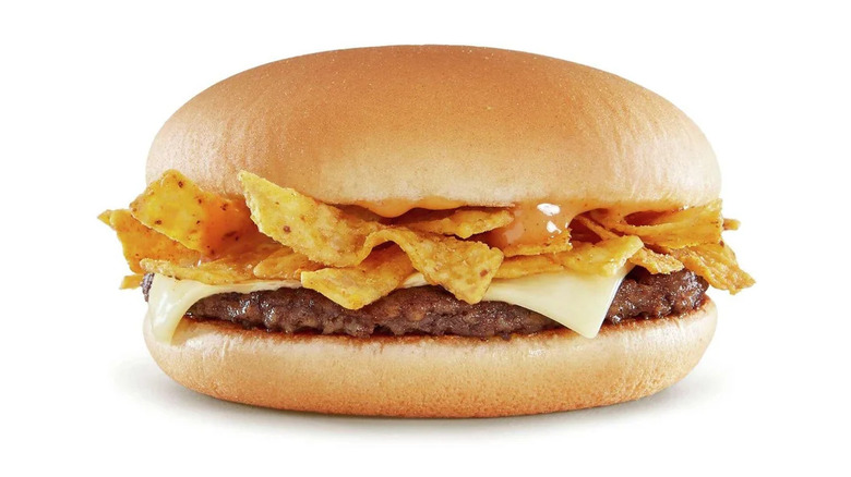 McDonald's BBQ Ranch Burger with tortilla chips and sauce on white background