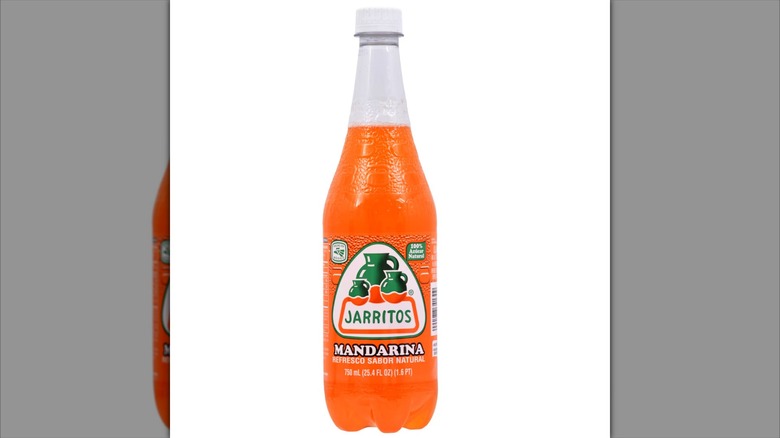 Bottle of Jarritos mandarina soda on white background