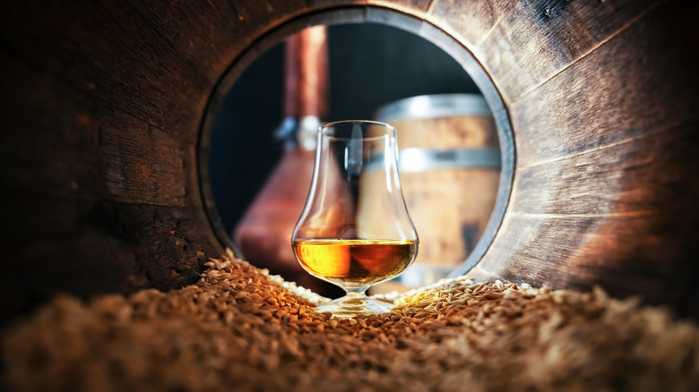Whiskey glass in a cask.