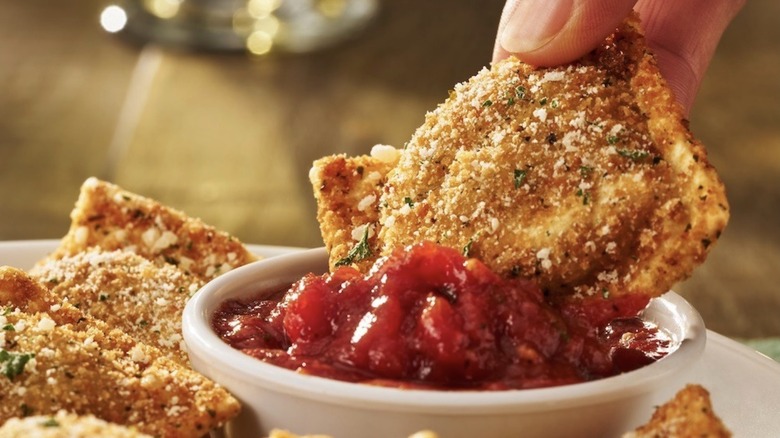 Crispy Toasted Ravioli dunked in marinara sauce
