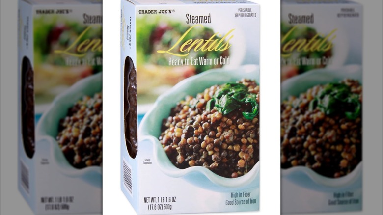 Package of steamed lentils on white background
