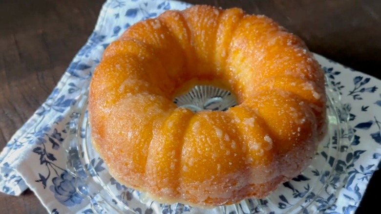 Kentucky butter cake on clear plate with cloth napkin underneath