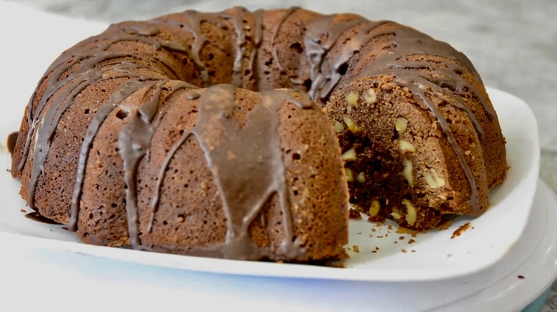 Tunnel of fudge cake on a white plate