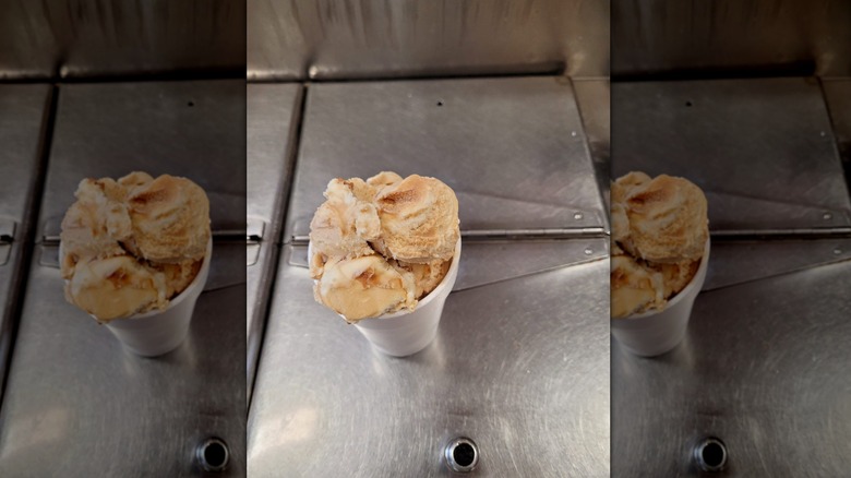 Blue Bell caramel ice cream in white styrofoam cup