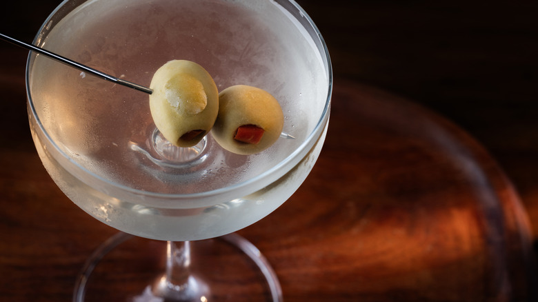 Topview of a martini coupe with two olives inside