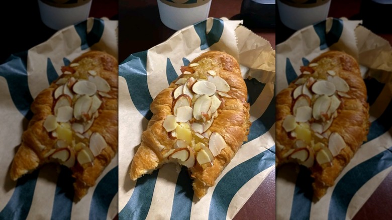 Starbucks Almond Croissant with bite taken out on wrapper
