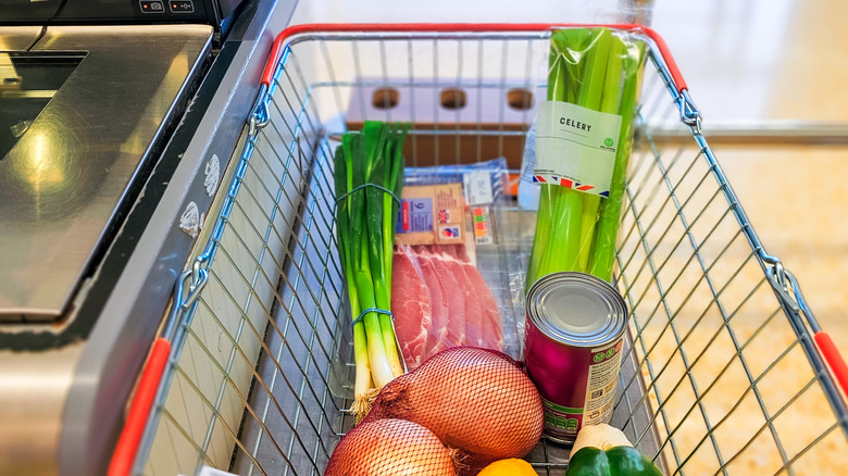Basket of grocery items at a self-checkout counter