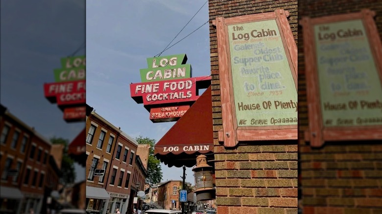 View of the Log Cabin Steakhouse's signage from the side of the building