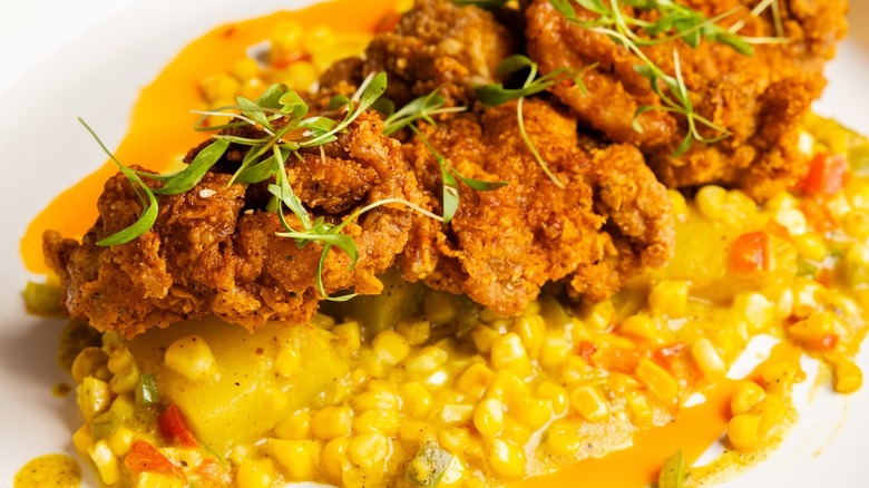 Spicy crispy chicken with creamy corn and greens