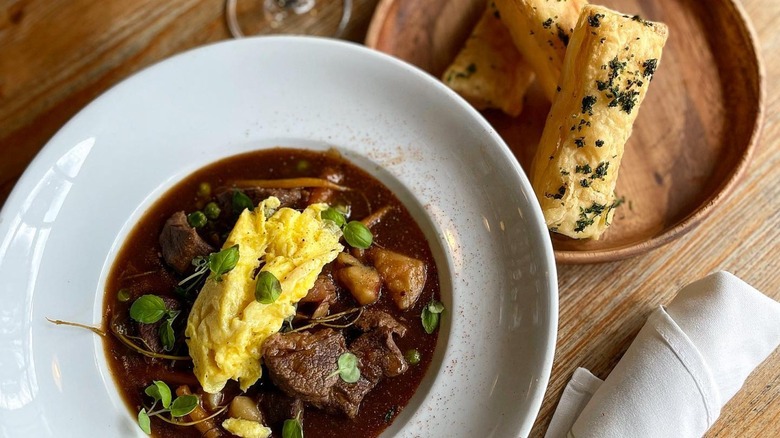 Braised beef stew and side of puff pastries