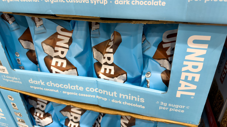 Close-up of a box full of bags of UNREAL Coconut Minis.