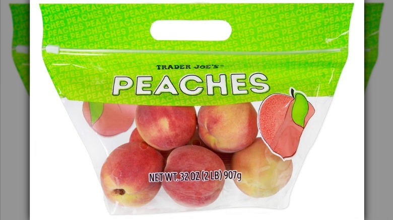 Yellow peaches in a bag on white background