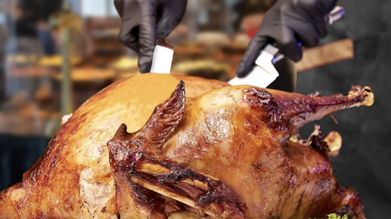 View of the El Torito Thanksgiving turkey being carved