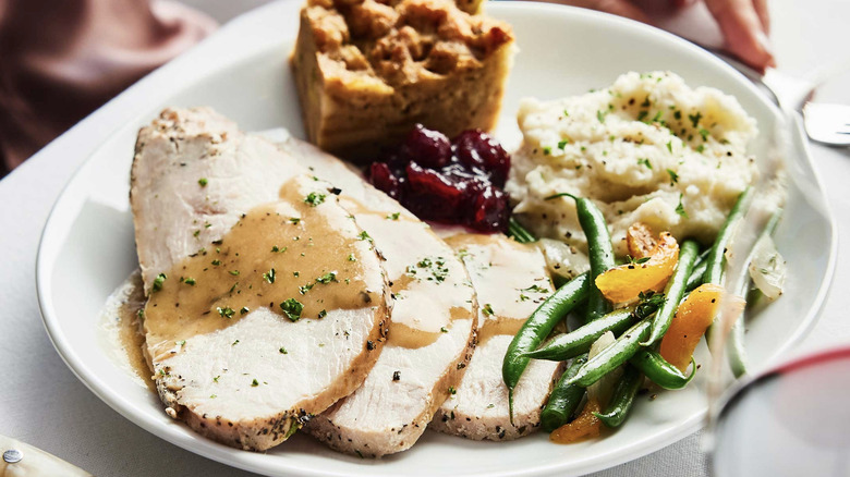 A full plate of turkey, vegetables, and other thanksgiving sides from Fleming's