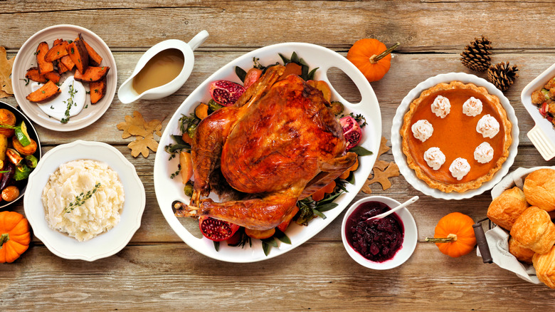 Full Thanksgiving spread including turkey, mashed potatoes, pie, and more
