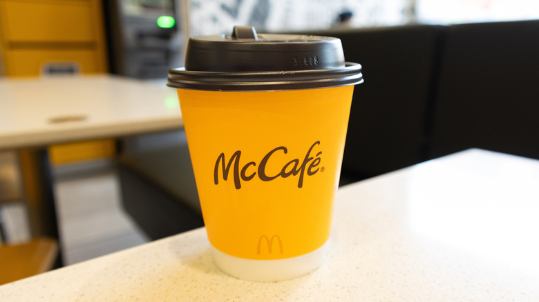 Small McCafe drink near the edge of a table