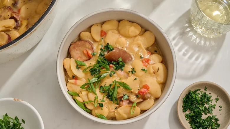 Creamy butter beans with sausage and ham