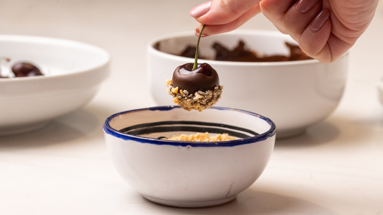 coating a cherry in hazelnuts