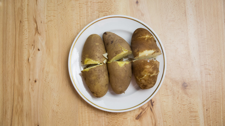 boiled potatoes on white plate
