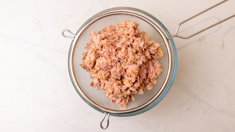 tuna draining in a sieve