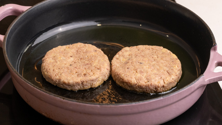 tuna patties cooking in pan