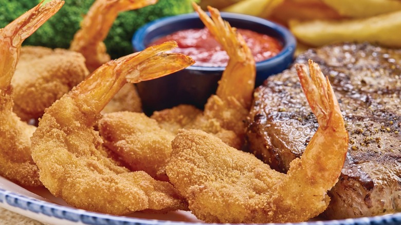 Walt's Favorite Shrimp pictured with cocktail sauce and steak