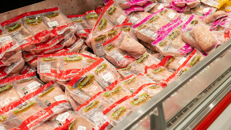 Kirkland Signature Organic Chicken Breast packages in freezer section at Costco