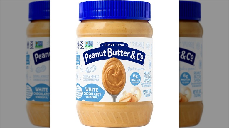 Plastic container of Peanut Butter & Co White Chocolatey Wonderful peanut butter spread