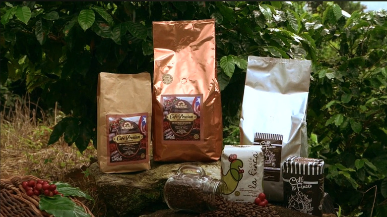 Some of Cafe La Finca's products displayed in front of a coffee farm.