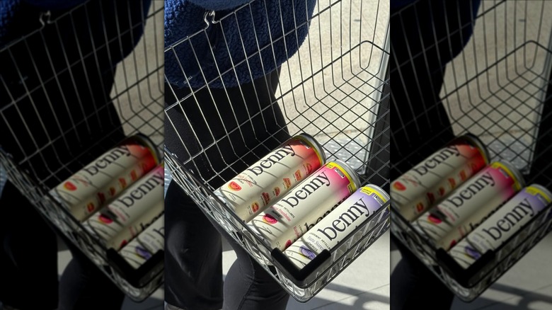 Three cans of Benny in metal basket