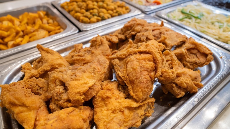 Buffet tray filled with fried chicken pieces at Golden Corral