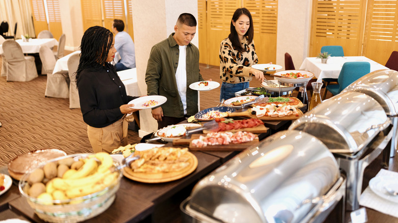 Diners picking food at a buffet