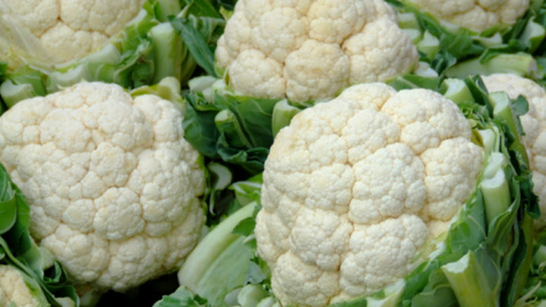 close up of cauliflower with leaves