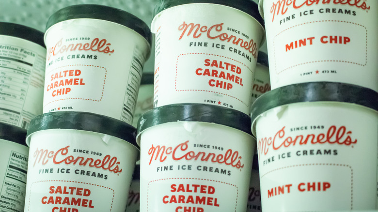 Pints of McConnell's Fine Ice Creams' salted caramel chip and mint chip ice cream in freezer