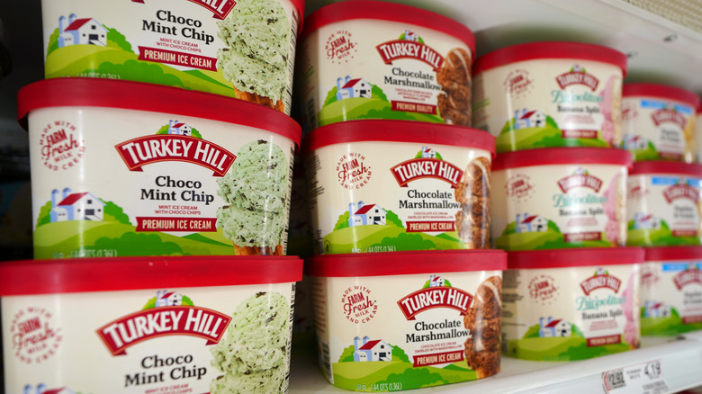 Cartons of Turkey Hill ice cream in various flavors on grocery store shelf