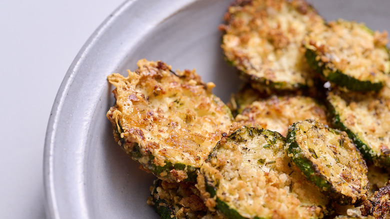 zucchini chip coated in breadcrumbs