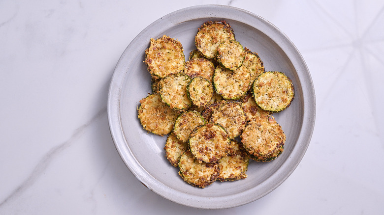 serving zucchini chips in bowl