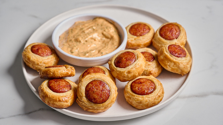 andouille puffs on a plate with remoulade