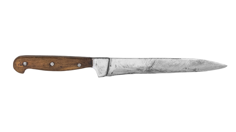 A vintage knife with a wooden handle